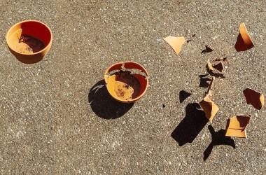 A photo showing three clay pots. The left pot is still intact, the middle pot is starting to break, and the right pot has shattered.